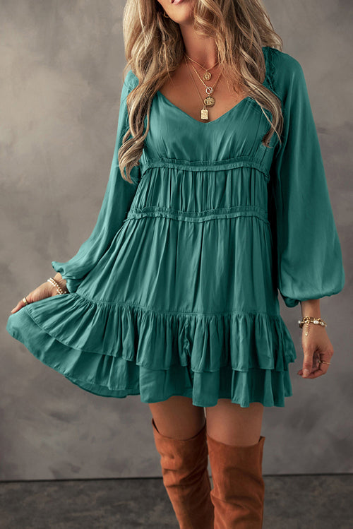 Elegant loose-fit dress featuring tiered ruffles and soft fabric
