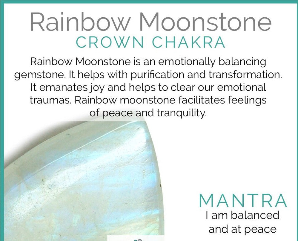 Rainbow Moonstone beads reflecting soft hues of blue and white under sunlight.