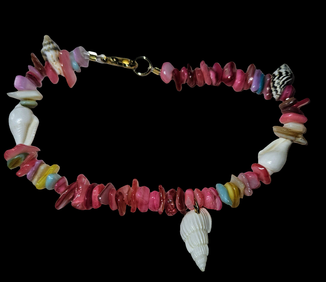 Colorful beaded bracelet with shell charms on a black background