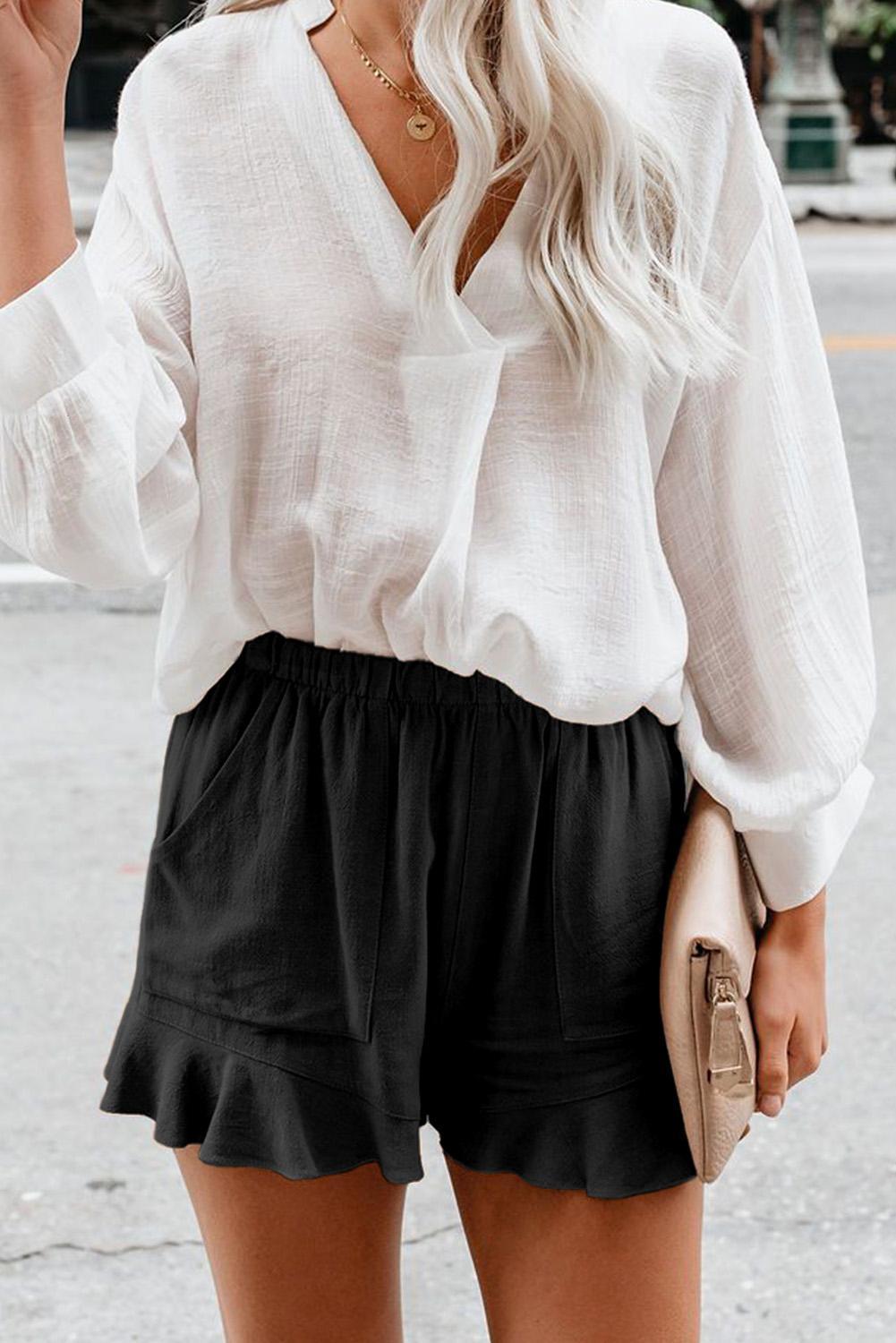Casual Pocketed Black Linen Cotton Shorts worn by a model, styled with a summer top.