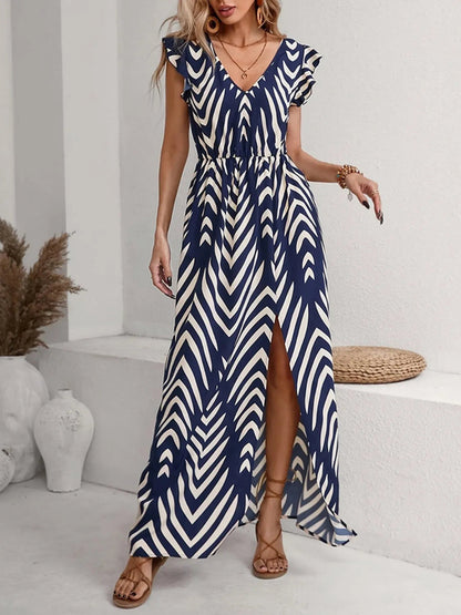 Model wearing the Printed V-Neck Cap Sleeve Maxi Dress, styled with minimal accessories for an effortless chic look.

