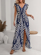 Model wearing the Printed V-Neck Cap Sleeve Maxi Dress, styled with minimal accessories for an effortless chic look.

