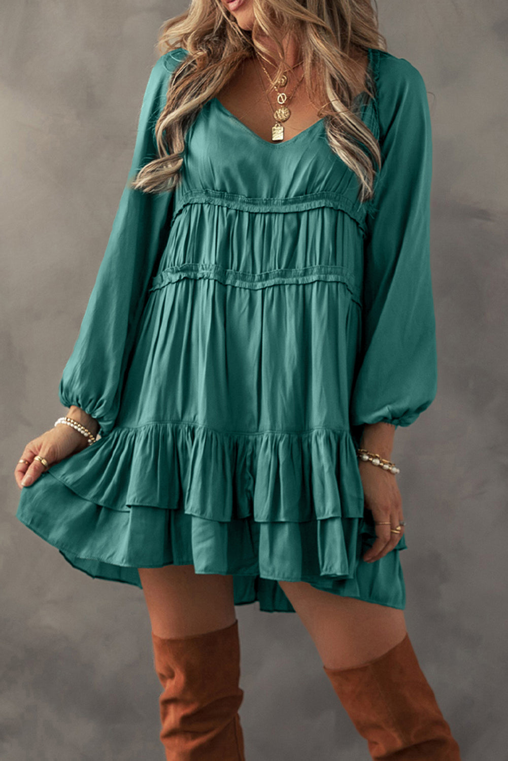 Elegant loose-fit dress featuring tiered ruffles and soft fabric