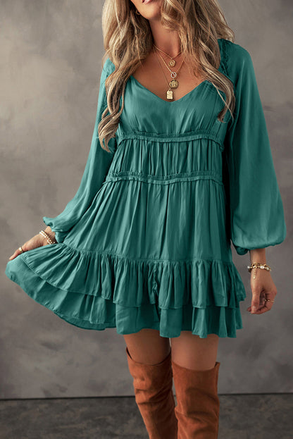 Elegant loose-fit dress featuring tiered ruffles and soft fabric