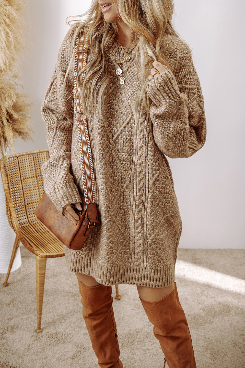 Cozy knit dress featuring soft cable texture and breathable fabric